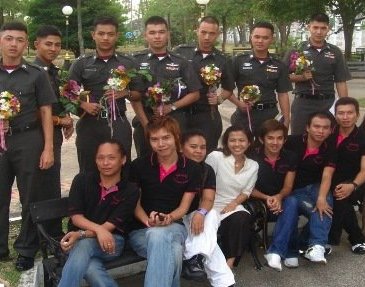 Outdoor group photo featuring Surang Janyam, SWING staff and Thai police cadets